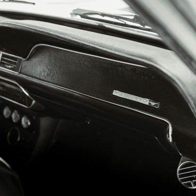 Black and white interior of a classic Mustang car, captured in Los Angeles for automotive enthusiasts.